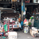 The man who worked at this garage disassembling Nissan Escargots was also the caretaker of the blue 240Z